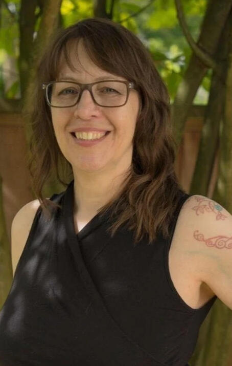 color headshot of Litbridge owner, Angela Doll